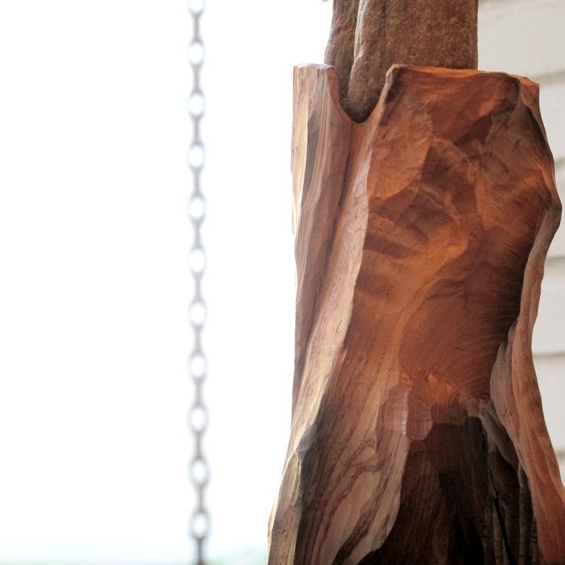 escultura madera y piedra